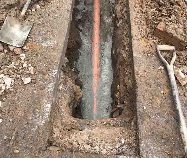 Causes of Drain Blockages - digging out leaking drain