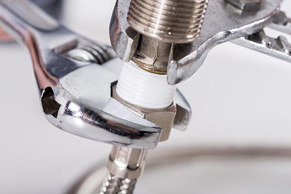 Plumbing services Blackpool - fixing leaky sink pipe