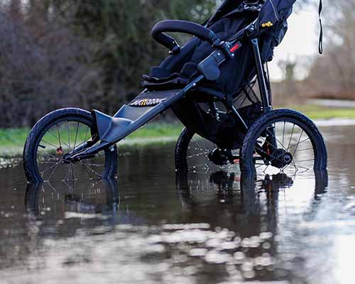 Push chair in flood water after drain collapse needing emergency drainage Blackpool services